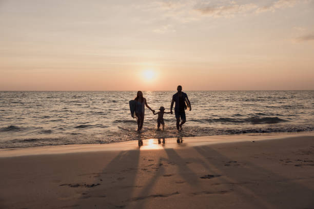 Family enjoying financial freedom on the beach after refinancing their home loan with Broker Connect